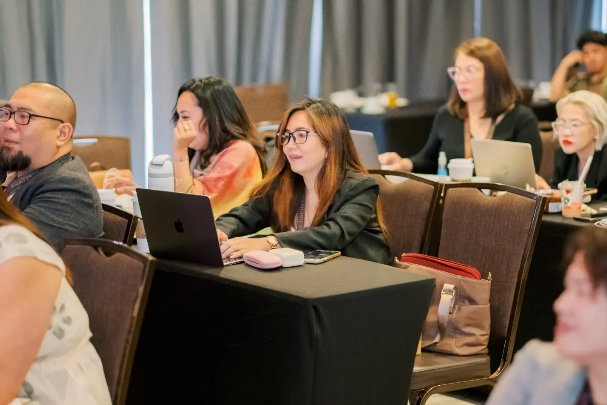 Participants building on their laptops