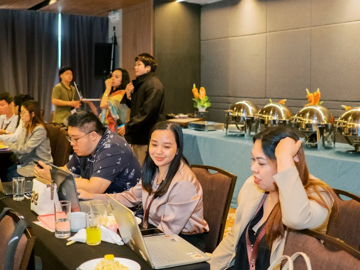 A full table of participants working