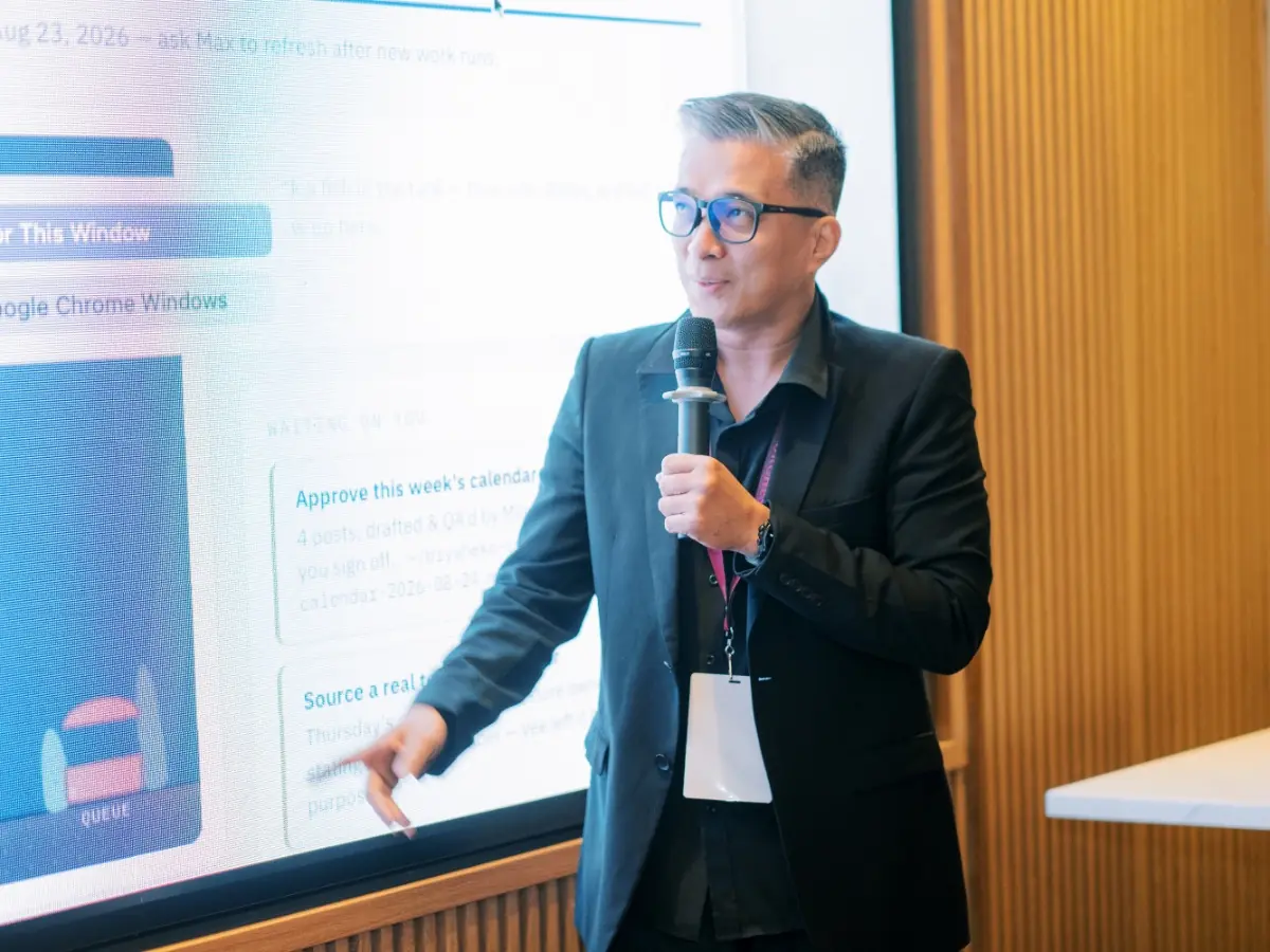 A guest walking the room through a live system on screen